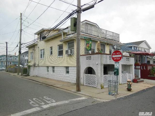 Two Family On Corner Of Oceanview Ave Steps To Beach. 1 Bedroom Over 3 Bedroom Apartments. Full Unfinished Basement W/ Garage. Front Porch On First Floor 2nd Floor Deck.