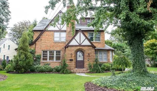 Turn Back Time For This Beautifully Renovated Vintage Brick Tudor.Replaced All Wood Trim Exterior-Professionally Landscaped-New Estate Fence-New Deck-New Sprinkler Syst.-New Garage Doors-3 New Bathrooms-Refinished Hardwood Floors-New Solid Wood Doors-All New Plumbing/Gas Conversion/Heating System And Central Air.Finished 3rd Floor W/Full Bath-Turn*Key.Close To All!