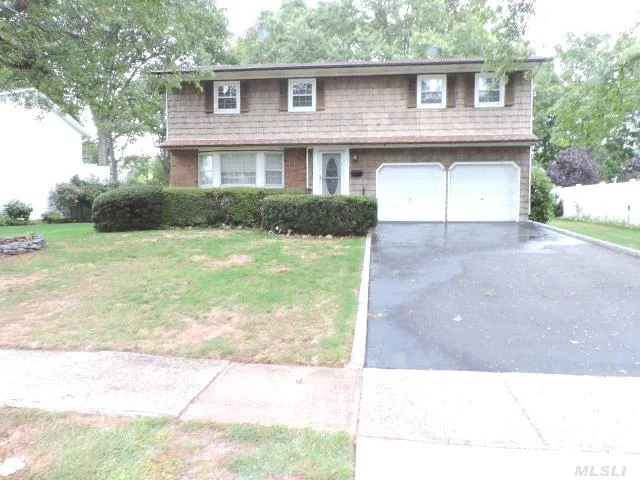 Great Mid-Block Location For This 5Br, 2400 Sq.Ft. Colonial South Of Montauk Hwy On 75X150 Property . Hardwood Floors Throughout. Full Dry Basement, Partially Finished. 2 Car Garage, Large Den W/Cathedral Ceilings & Skylight! Good Room Sizes & Lots Of Closets. Close To State Park ! A Lot Of House For Money!