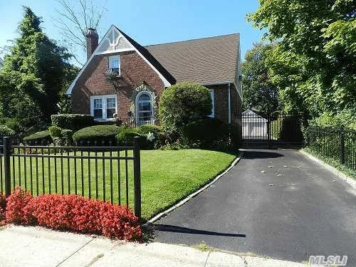 Beautiful Brick Tudor Circa 1933 In Islip Village!- 4 Large Bedrooms, 2 New Baths, New Kitchen With Granite & Stainless Steel Appliances, Gorgeous Hardwood Floors Throughout, Fireplace, Custom Mouldings & Glass Door Knobs, Front Porch And Enclosed Back Porch, Big Detached 2 Car Garage. All Located On A Lovely Quiet Street!- This Is The One You Have Been Waiting For!-