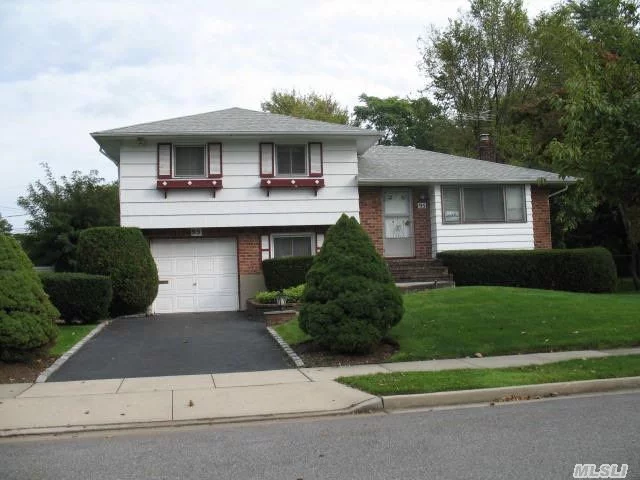 New Central Air Conditioning System- New Roof-. Wall To Wall Carpet - Hardwood Floors- New Oil Burner-Wood Deck-Cement Patio.