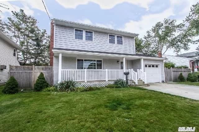 Diamond Colonial!! All New Kitchen, Granite, /Stainless, New Baths, Wood Floors Throughout!New Roof , All New Windows! New Gas Heating, Siding! Wood Floors, Finished Basement!