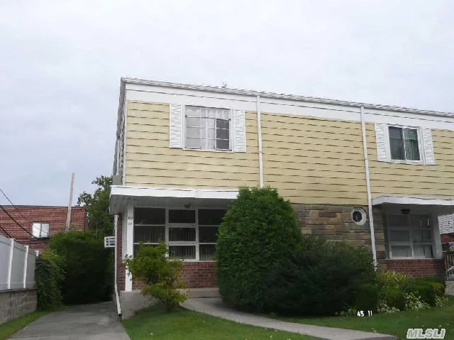 Beautiful Semi 1 Family W. Sep. Ent To Basement, On Quite Block, Half Block To Northern Blvd., School Dist. 26, Ps31. Ms 158. & Bayside Hi. Gas/Radiator Heating, Brand New Roof, Wood Floor Underneath The Carpet, Walk To Lirr, Lots Of Potential