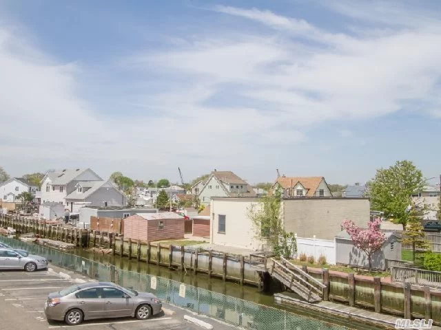 Large 2 Bdrm 2 Bath 2nd Floor Split Waterfront Unit With Plenty Of Storage. Hardwood Floors, Large Living Room/Dining Room Combo, Nice Size Kitchen W/Sliders To Terrace Overlooking The Canal. Large Master With Private Bath, Attic Access. 3 Ac&rsquo;s. Great Unit!