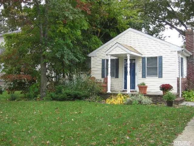 Charming Cottage In Massapequa School District #23. Nice Yard With Patio. Large Walk In Shed And A Small Shed. Washer And Dryer In The Home. Nice Location