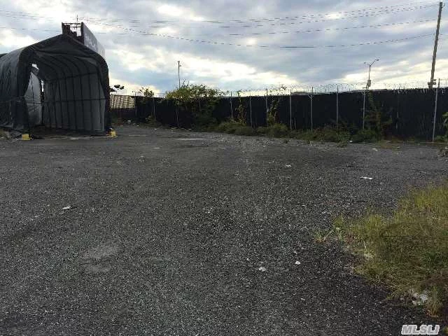 Vacant Lot. 8000 Sf. Fenced With Huge Gates And Electric Is In.