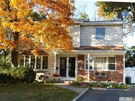 Center Hall Colonial With Formal Entryway. 5 Bedrooms. 2 1/2 Baths. Tiled Family Room With Sliding Glass Doors Opening Up To An In-Ground Pool With Brick Patio Surround. Great Space For Entertaining Both Indoors And Out. Tree Lined Street. Close To Syosset Lirr Station. Syosset Schools. Basement Has Extra High Ceilings. Taxes Have Never Been Grieved.