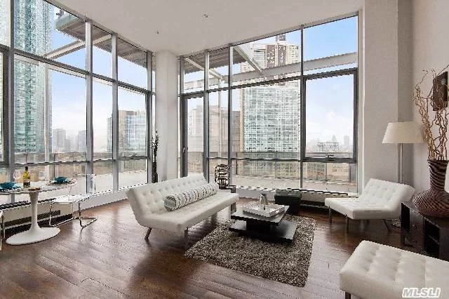 Welcome To This Luxurious Penthouse Located In An Up And Coming Part Of Lic Featured With A 1000Sf Wrap Around Terrace Larger Than Most Apartments. Upon Entering You Encounter Breathtaking Views Of Manhattan Facing West Along With South And North Views. The Living Room Is Surrounded By Wrap Around Floor-To-Ceiling Windows Throughout Boasting 16Ft. Ceilings Throughout.