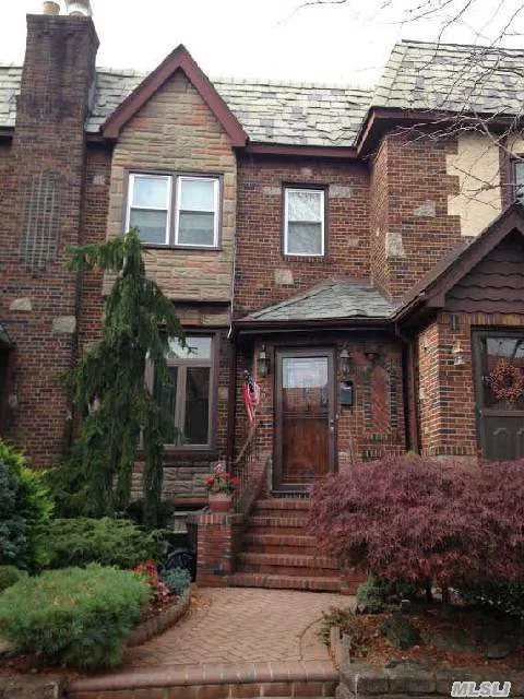 Spacious , Tudor  Attached House. Hardwood Floor. Updated Eik, Bth, Garage. Walk To Northern Blvd, Lirr. Well Maintained House.