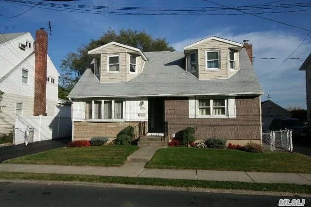 Detached Legal Two Family Home. First Floor Features Living Room, Dining Room, Kitchen W / Oak Cabinets, Den W / Sliders To Yard, Master Bedroom W / New Full Bath, Second Bedroom, And Hall Bath. First Floor Has Access To Full Basement. Second Floor Apartment Has Living Room, Eat-In Kitchen, One / Poss. Two Bedroom, And A Full Bath. Private Driveway And 1.5 Car Garage.