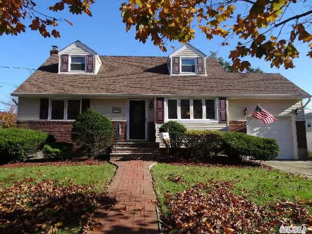 Charming Cape W/Open Floor Plan Featuring Brand New Arch Roof/Siding/Front & Garage Doors/Summer Kitchen & 1/2 Bath In Basement. Updated Windows, Oak Floors, Updated Bath, Gas Boiler & New Gas Hot Water Heater. Sliders Off Dining Rm To Deck