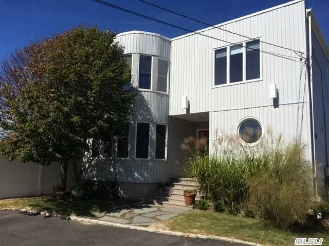 Sunny & Bright 4 Bed, 3 Bath Contemporary Colonial In Massapequa For $479, 000. Situated In Beautiful Nassau Shores With Bay Views, This Home Has A Completely Open Floor Plan With Huge Open Areas & A Chefs Kitchen, Perfect For Entertaining! Built In 1991, This 2700 Sq Ft Home Had No Sandy Damage. Boasting A Huge Master Bedroom Suite, Cac, Gas Cooking/Heating & Much More!