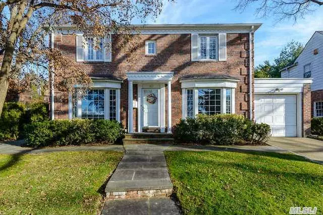 Classic Brick Center Hall Colonial Boasts 4 Brs., 2.5 Baths. Living Room With Fireplace, Large Formal Dining Room, Eik Leads To Family Room, Maid&rsquo;s Room And Half Bath On First Floor. New Gas Heat. Landscaped Flat Backyard With Patio. Convenient To Town, Shopping And Lirr.