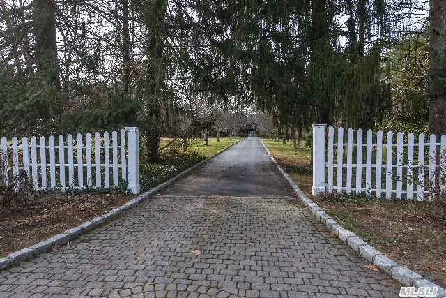 Long Driveway Leads To Charming 3 Br Colonial W/ Front Porch, Grand Living Room W/Fpl, French Drs To Terrace, Sun/Rm/Den, Lib, Fdr, Eik. Separate Carriage House W/Guest Rm/Bath, 2 Professional Office, Bath And Barn Loft, 4 Car Garage. Pool & Pool House W/ Full Bath. Professionally Landscaped. Prospective Purchaser To Verify All Info. Beach & Mooring. Csh Schools.