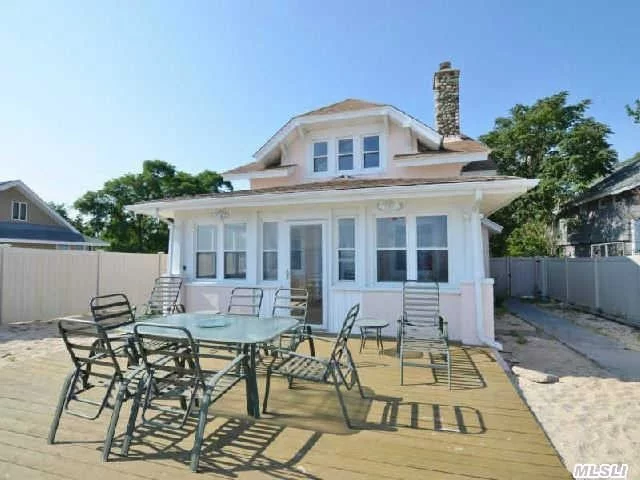 Wow!! Room For Extended Family.. This Unique And Charming Home Over Looks The Li Sound. Picture Perfect Sunsets. Huge 6 Car Professional Garage Perfect For Water Sport Toys Or Many Other Possibilities. Enjoy Living The Beach Lifestyle.. Owner Will Entertain All Reasonable Offers.