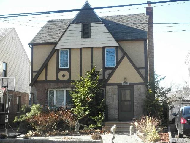 Classic Detached Tudor Colonial In Excellent Condition ! Charming Living Rm W/Fpl. New Granite Mod Kitchen , Newly Renovated Jaccuzi Bath & New Roof, Prime North Bayside Location. Best School Dist#26. Walk To Lirr