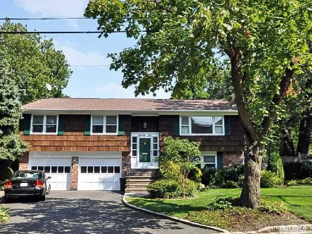 Wonderful Home Located In The Heart Of Beautiful Oyster Bay A Short Walk To Waterfront. Home Expanded With Media/Family Room, Spectacular Media Built Ins, Top Of The Line Sound System, Beautiful Heated In Ground Fiberglass Pool. This Home Also Includes A Secluded Hot Tub To Complete Your Outdoor Oasis.