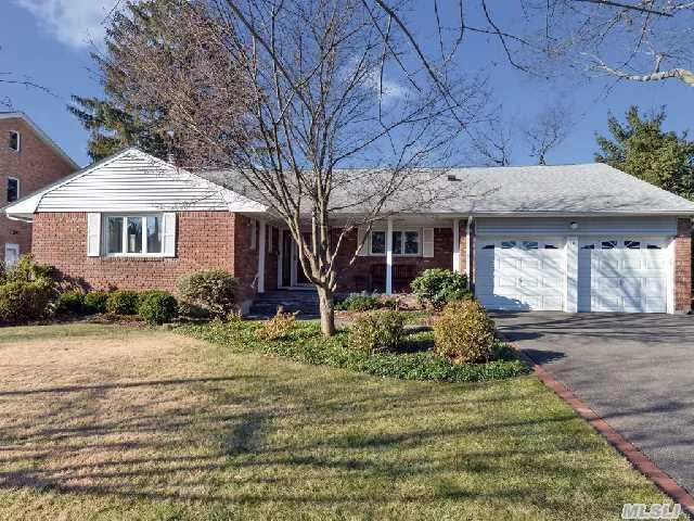 Gorgeous 3 Bedroom Ranch Situated In The Desirable Neighborhood Of Syosset Woods! Some Of The Updates Include Custom Kitchen With Ss Appliances , Updated Bathrooms, Newer Roof, Updated Electric, Blue Stone Walk And Porch. Master Suite With Private Bathroom, Hardwood Floors Through Out, Professionally Landscaped Private Yard. Move Right In To This Wondeful Home!