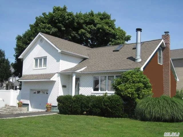 Move Right Into This Immaculate & Expanded Split. It Has A Beautiful New Bath, Updated Eik W/Gas Cooking, Crown Moldings, Dormered Top Floor Providing A Large Master Bedroom W/2 Closets, Recently Remodeled Basement,  Completely Vinyl Sided & All Replaced Windows, Partial New Roof And More! Plainedge School District.... Great House!!
