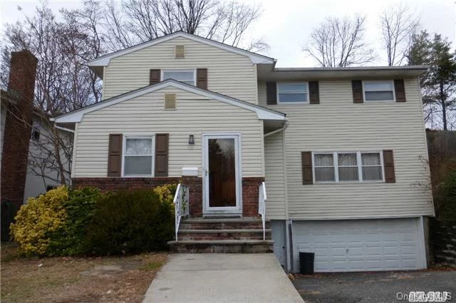 Colonial 4Br/2.5 Baths With Very Large Living Room, Den, Formal Dining Room, Eik. Master Br With His & Hers Walk-In Closets And Full Bath. Full Finished Basement, 2 Car Garage And Yard. Steps Away From Great Neck North School.