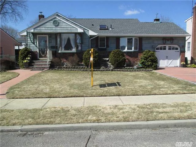 Beautiful Oak Floors Throughout, 2 Yr Old Roof, 3 Bedr, Full Bath, 2 Skylights, 3 Bay Windows, Enclosed (31X16) Fla. Rm Back Of House, Retractable Awning, Alarm System, Inground Sprinklers & In Wall Vacuum System. Also Has Street Gas Connection In Basement. Large Flowering Backyard Now That Spring Is Here! A Great Buy.