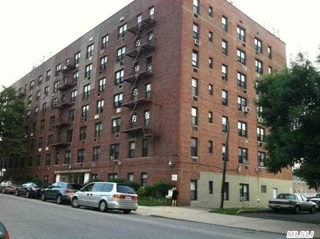 Location! Location! Location! Corner Of Melbourne Ave & Kissena Blvd, Queens College Across Street, Convenience To Shopping & Transportation! Cozy Living Room, Brand New Tiles In Bathroom Kitchen With Counter Top. Laundry Room In Building. Top Floor, Views Of City Light.,