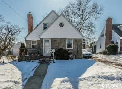 Cozy Brick/ Field Stone Cape Set On 55 X 100 Lot. Mid-Block Location On Quiet St. In Milburn Section. 4 Bedrooms, 2 Full Baths, Large Eat-In Kitchen, Living Room With Fireplace, Full Basement & 1 Car Attached Garage. Many Updates Thru-Out Inc. Roof, Windows, Electric. Don&rsquo;t Wait This House Will Not Last.  .