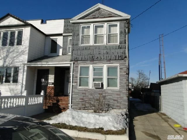 Huge Opportunity - Large Yard With Pvt Driveway With 2 Car Garage Are The Outside Features Of This 2 Family Home Located In The Heart Of Ozone Park. 2 Bedrooms On The First Floor With Large Basement And 3 Bedrooms On 2nd Floor Make This Home Perfect For Income Of A Family. Needs Some Cosmetic Updating But Boasts New Windows, New Doors, Updated Heating System,  No Fha