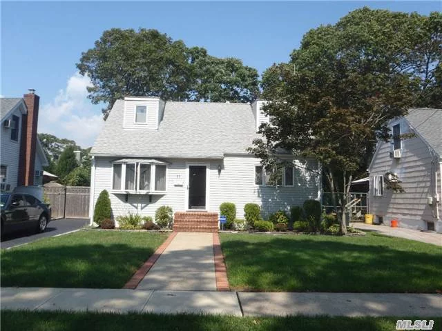 Updated Eat In Kitchen W Sliders To Patio, 2 Full Bth, Beautifully Finished Full Basement, W Den, Granite Bar And Office. Updated Heating W Hot Water Heater, 10 Yr Old Roof, Fenced Yard, Plainedge School District !!!