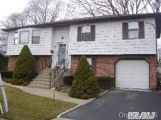 Great Opportunity To Own A 4 Bedroom, 2 Bath Hi-Ranch In Farmingdale With Room For The Extended Family. . Located Near All. Buyer To Verify All Information Independently.