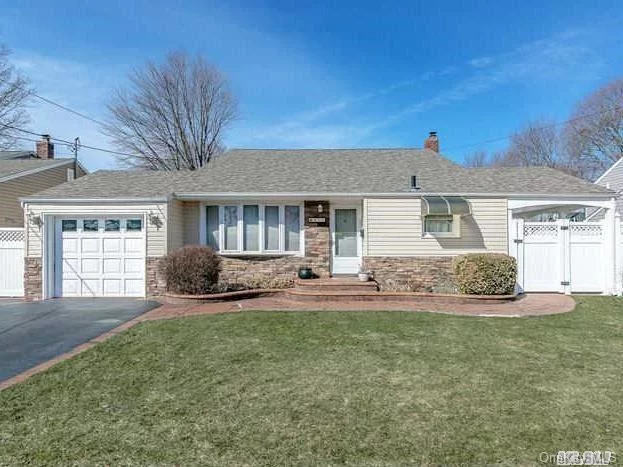 Massapequa Park; Split Level Home With 3 Bdrms;8 Rms;1.5 Bths In The Farmingdale School District. Meticulously Maintained Home With Gleaming Wood Floors Throughout.Beautiful Landscaped Yard W/Sprnkler Sys; Pvc Fencing/Double Gates;Vinyl Siding, Soffets And Roof 2Yrs Old.Kitchen Has Entrance To Yard With Patio And Awning For Summer Entertaining. Lovely Home To Call Your Own.