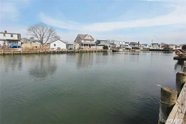 Fantastic Price For Waterfront Property In Massapequa Shores! Lovely Expanded 5Br 2 Bath Cape. Updated Kitchen With Spacious Eating Area. Sundrenched Family Room Overlooks The Oversized Property On Extra Wide Jefferson Canal.80 Ft Bulkhead. 2 Car Garage W/Attached Breezeway. Updated Boiler, Roof &Electric. Full Basement W/8 Ft Ceiling. Walk To Park And Florence Beach.