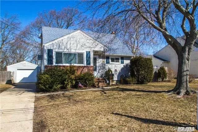 Recently Updated 5 Bed/2 Bath/1.5 Garage Expanded Cape In East Islip School District. Granite Kitchen W/ Stainless, Living Room, Dining/Family Room, 5th Bed/Office, Refinished Wood Floors. Full Basement With Brand New 200Amp Electric, Gas Heat, Washer/Dryer, Updated Roof, Siding & Windows. Just Move In & Unpack !!