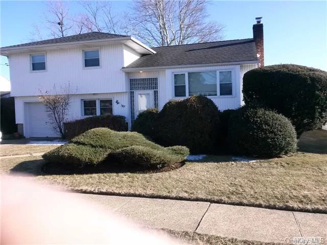 This Mid Block Split Has Nice Curb Appeal. Including Newer Heat, Roof, Windows And Siding. Very Nice Size Den With Sliding Doors To Yard. Plenty Of Closets. A Must See!!!!