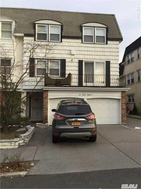 Spacious 3 Br/ 2 Bth Duplex Apt, Totally Renovated,  Wooden Floor, Updated Kit, Bth.   Terrace,   Granite Counter Top , Stainless Steel Oven & Refrigerator. Move In Condition. 1 Car Garage.