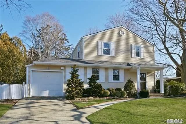 Bright Expanded Colonial Is Set On Beautifully Landscaped And Tree Lined Property. The Foyer Leads To A Gracious Dining Rm With Fireplace Which Expands To A Lv. Rm With A Back Wall Of Windows That Showcase The Newly Landscaped Property. Extended Eat-In Kitchen Is Appointed With Wood Cabinetry,  Award-Winning School District,  Https://Vimeo.Com/Channels/Mineolaschooldistrict