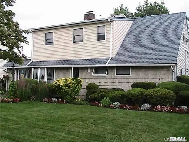 Mint, Mid Block Located Colonial Features 3 Bedrooms, 2 Full Baths, Formal Living Room, Formal Dining Room, Large Family Room With Wood Burning Stove, Master Bedroom Has Glass Sliders Going Out To Covered Balcony. Professionally Manicured Grounds. Newer Roof And Burner. Anderson Windows Throughout.