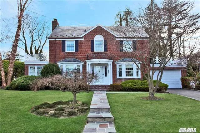 Immaculate Plandome Heights Traditional All Brick Center Hall Colonial With Slate Roof. Beautiful Designer Custom Kitchen With Viking 6-Burner Stove. 2 Car Garage, Large Living Room With/Wainscoting And Large Bay Window. Natural Light Floods. Many Upgrades.