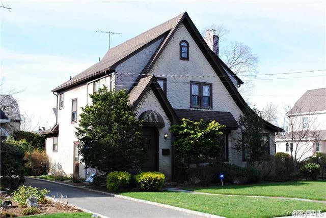 Prestigious Cathedral Gardens Section Of West Hempstead, Charming Stucco Tutor On Tree Lined Street. Immaculate Home Has A Traditional Layout Including A Formal Living Room With Fireplace, Formal Dining Room, Den, Granite & Stainless Eat In Kitchen & Powder On Main. Upstairs Are 3 Bedrooms With A Full Hall Bath. Partially Finished Basement Has Laundry. This Is Home!