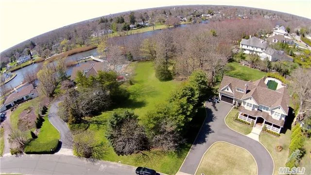 Percy Williams Cove. Last Waterfront Lot In Development. 1.16 Acres With Pond. Build A Bridge Over The Pond And Dock Your Boat On Champlins Creek. West Coast Sunsets. Association Tennis And Docking. Build Your Dream Home In This Sought After, Private Waterfront Neighborhood.