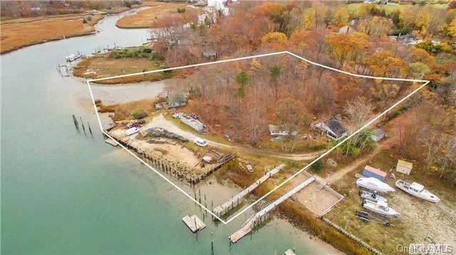 Beautiful Rare Location On Mattituck Inlet. 508 Feet Of Waterfront Property With Approx. 150Ft Of Bulkhead And 200Ft Of Basin. Deepwater, Dock Needs Repair. 3 Structures On Property Which Were Summer Bungalows. Property As-Is. Beautiful Views Of Connecticut.