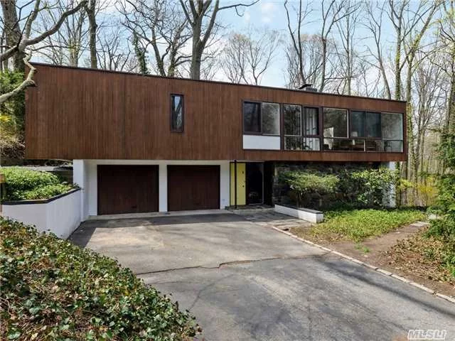 Authentic, Mid Century Modern 4 Bedroom Home Designed By Modernist Architect William Landsberg. Floor To Ceiling Windows Bring The Outdoors In And Create The Feeling Of Living In A Nature Preserve. Spacious Entertaining Spaces, Eik Opening To Patio & Beautiful Grounds. .4 Mile To Lirr. Convenient To All.