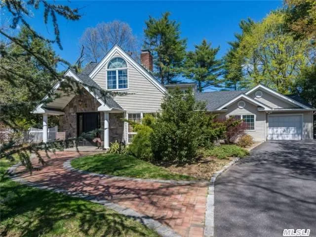 With All The Charm Of An Enchanting Cottage In The Woods, This Beautifully Renovated And Expanded Cape Welcomes Guests With A Graceful Brick Walk And Large Gabled Front Portico. Its Open And Sprawling Floor Plan Is Full Of Character And Offers Ample Sunny Views Of Its Third-Acre-Plus Verdant Grounds Through A Myriad Of Windows.