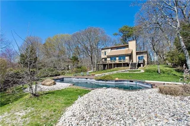 Deep Water Floating Dock And In Ground Pool Come With This Waterfront 4 Bedroom Contemporary. Easy Access To Li Sound, Beautiful Westerly Views And Sunsets Complement The Overall Wooded Private Setting.