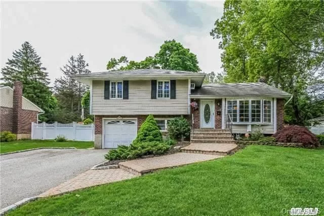 Lovely Updated Extended Split Level Home. It Has An Extended Kitchen And Dining Room.This Home Is Updated Thru Out Including Granite Kitchen, Bathroom, All Windows , Interior And Exterior Doors, Gas Burner. Newly Finished Hardwood Floors.Freshly Painted.Updated Siding And Roofing. Pavers On The Front-Walk And Back Patio.Beautiful Fenced Yard With White Pvc Fencing.Hot Tub.