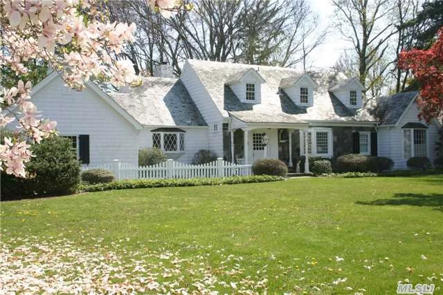 Lovely Walter Uhl Cape On Large Flat Property. Large Master Suite On First Floor. Wide-Plank Wood Floors And Custom Woodwork Throughout. Loft Library Overlooking Sunken Formal Living Room With Beamed Cathedral Ceiling. Two Bedrooms And One Full Bath Complete The Second Floor.