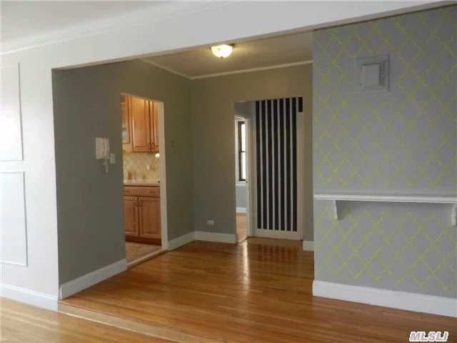 Sun Drenched 2 Bedroom(Jr 4) On The 2nd Flr Of Elevator Bldg Or Easy Walk-Up! Large Living Room/Dining Room. Updated Kitchen Leads To Additional Rm For Eating/Office! Huge Master W/Elfa Closet Organizer. 2nd Br, Full Updtd Bath, Closets Galore! Easy St. Pkg Or Garage Pkg(Small Wait+Fee). Close To E/F, Bus And Gcp/Vanwyck. Maint. Inclds Taxes, Heat & Water. Live-In Super!