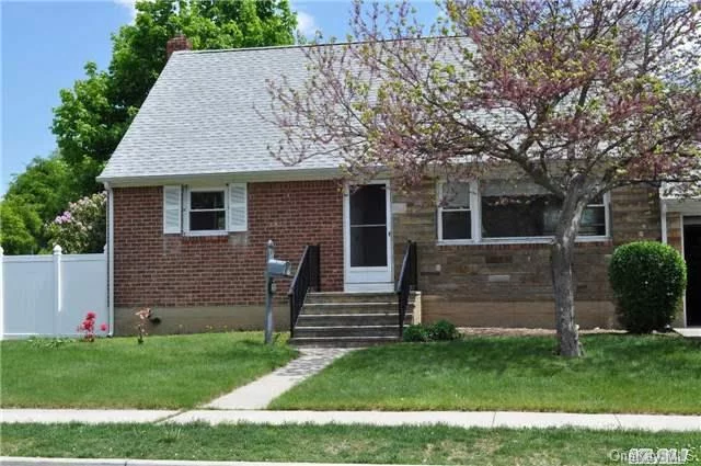 Cape On Corner Lot In Syosset School District. Original Owner. Home Being Sold As Is. Home Has Great Potential. Fenced In Yard And A House Generator Direct Wired To Panel.