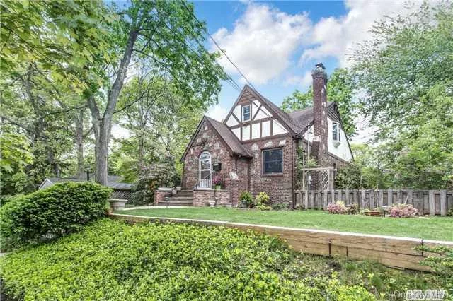 Expanded Historic Tudor In Quiet Neighborhood. Property Features Expanded Eik Overlooking Park Like Backyard. Master Bedroom Features Master Bath, Large Wic, And A Large Deck Overlooking The Property. This Is A Very Unique Home To The Area. Must See In Person To Appreciate. .5 Mile To Lirr, Next To The Massapequa Preserve