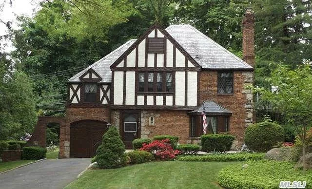 Traditional South Strathmore Tudor With Slate Roof & Stained Glass Windows. 4 Brs, 2.5 Bths, Lr W/Fpl, Formal Dr, Family Room, Full Basement